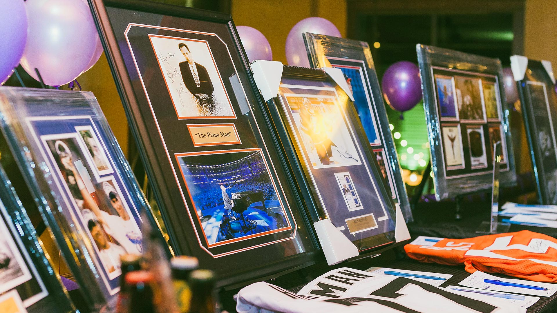 Auction items at an event run by SociallyFunded